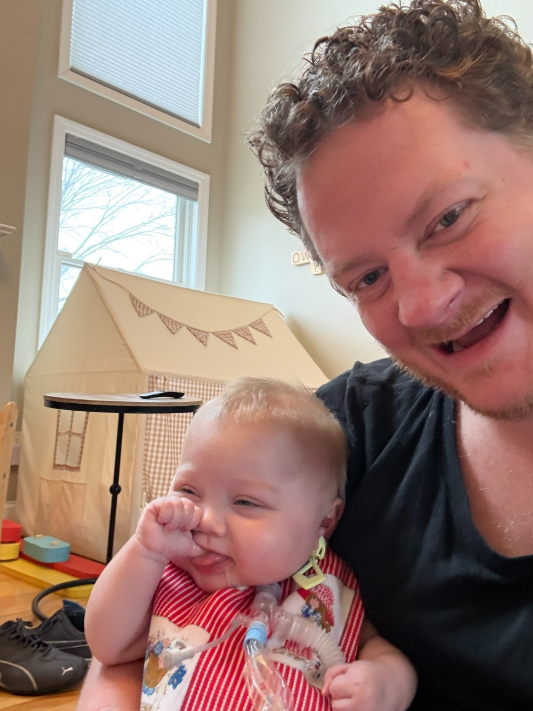 Iris and her father at home, laughing together