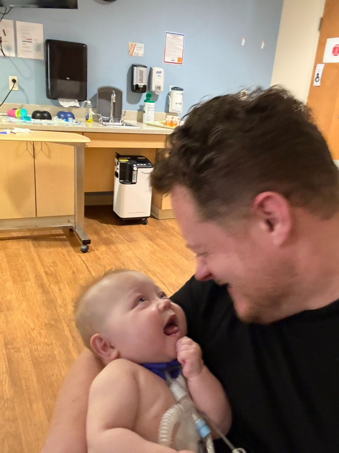 Iris with her dad, both smiling