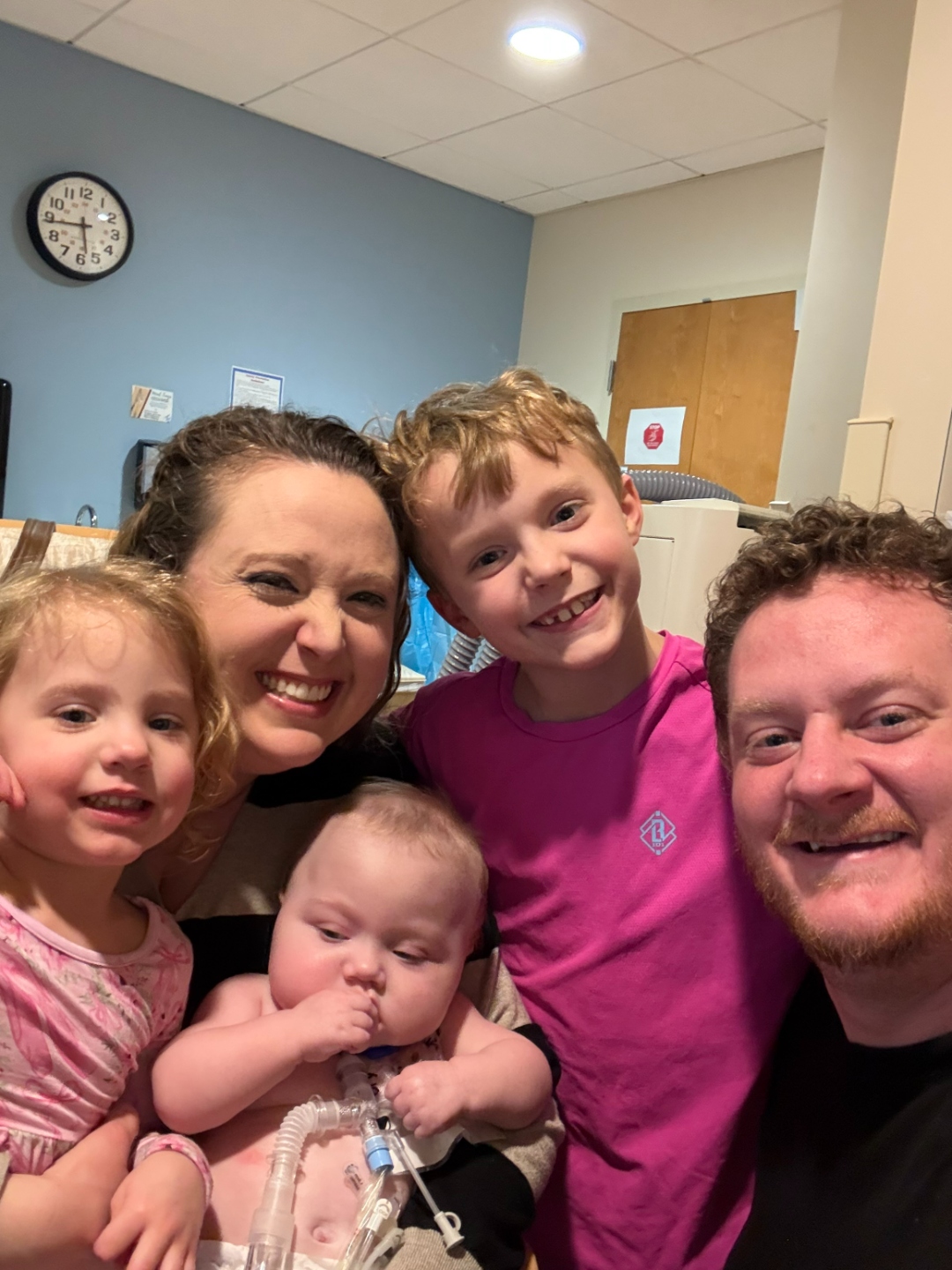 The entire LaValle family together — parents, siblings, and Iris — all smiling